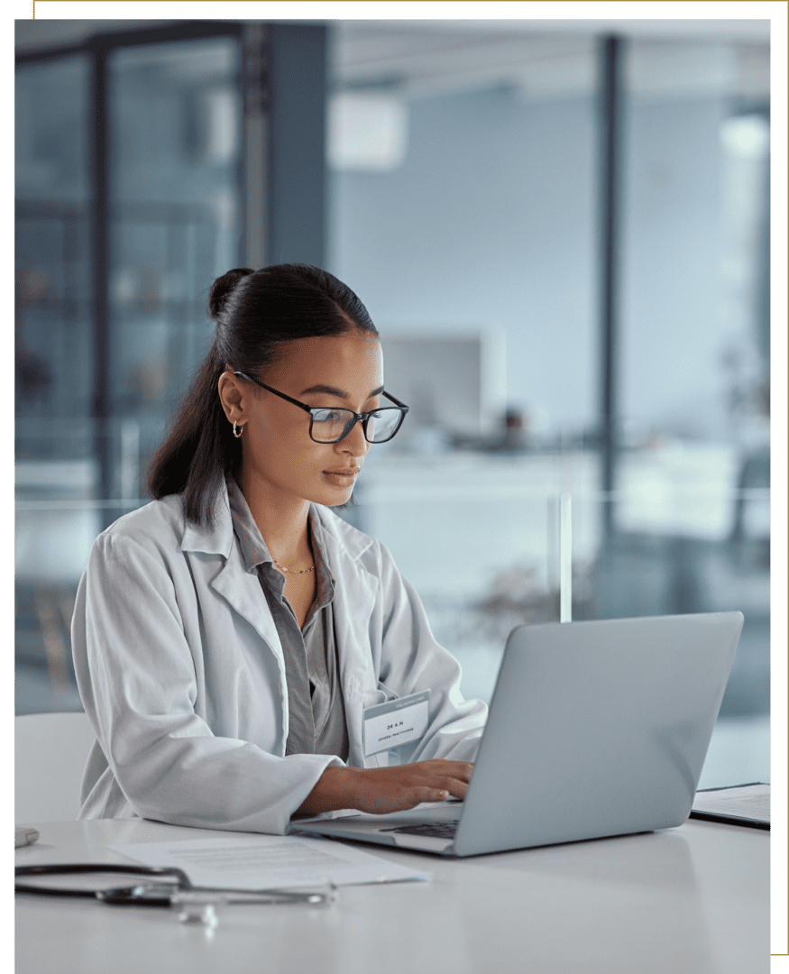 Female doctor focused on laptop work