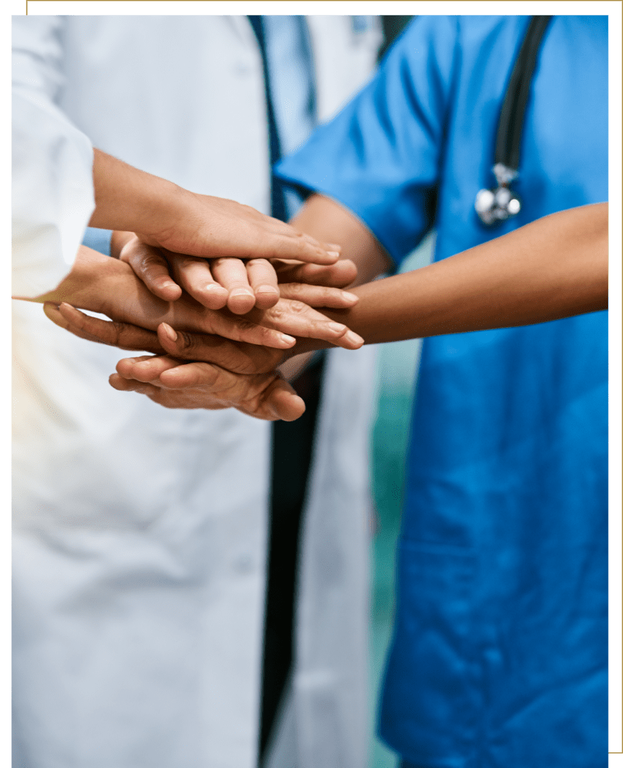 Medical professionals joining hands in unity